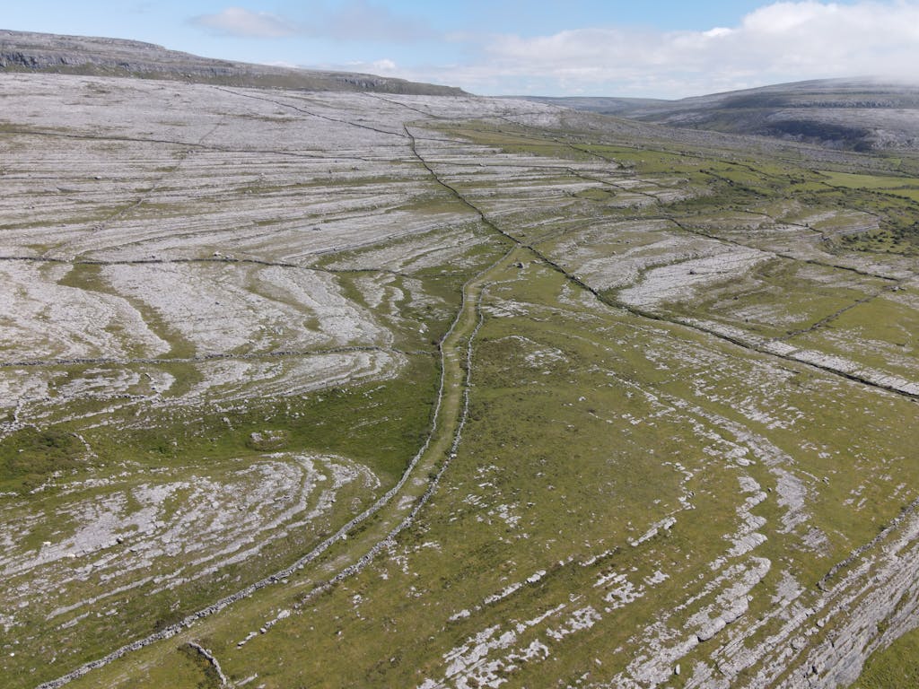 Explore the unique rocky landscape of the Burren in County Clare, Ireland.